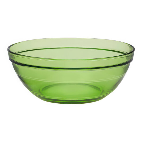 A green Duralex glass bowl with a black rim.