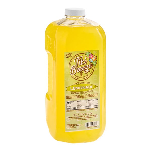 A large yellow plastic jug of Tiki Breeze Caffeinated Lemonade Energy concentrate.