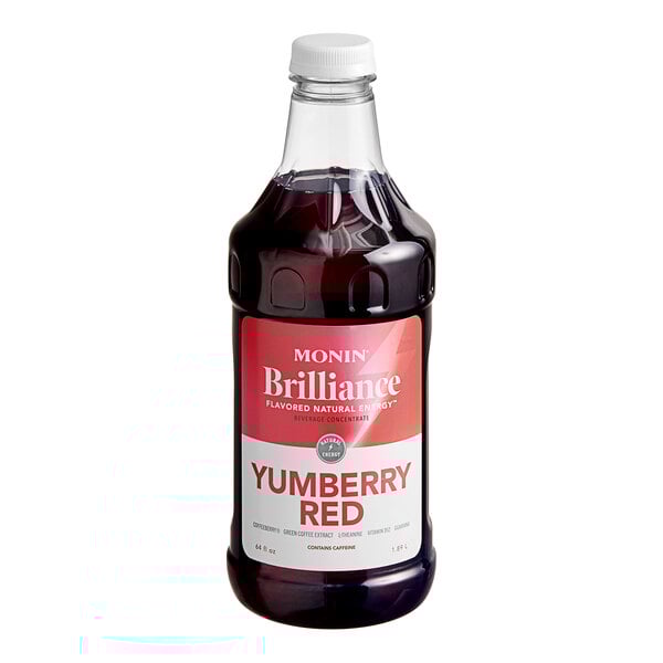 Monin Brilliance Yumberry Red Energy Concentrate in a bottle with a red label and white cap.