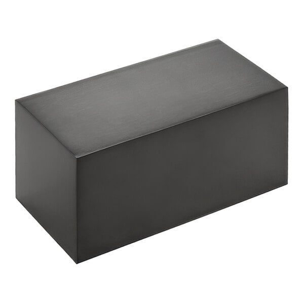 A black stainless steel rectangular riser by American Metalcraft on a counter.