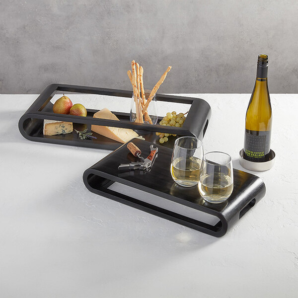 An American Metalcraft espresso wood serving tray with wine glasses and a bottle of wine on it.