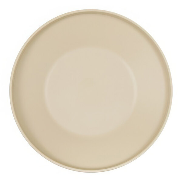 A taupe plate with a round rim on a white surface.