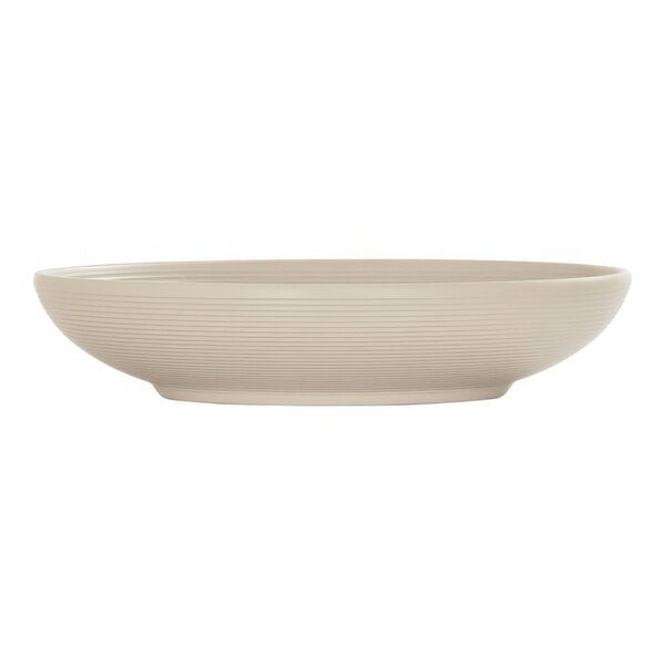 A taupe melamine bowl with a white interior and rim.