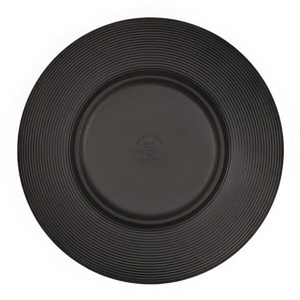 A black Cal-Mil melamine plate with a circular pattern.