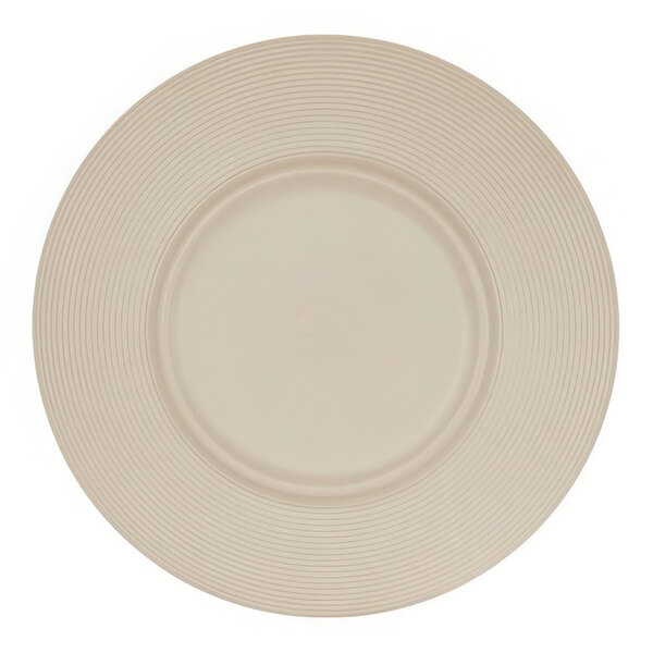 A close-up of a taupe Cal-Mil melamine plate with a circular pattern.