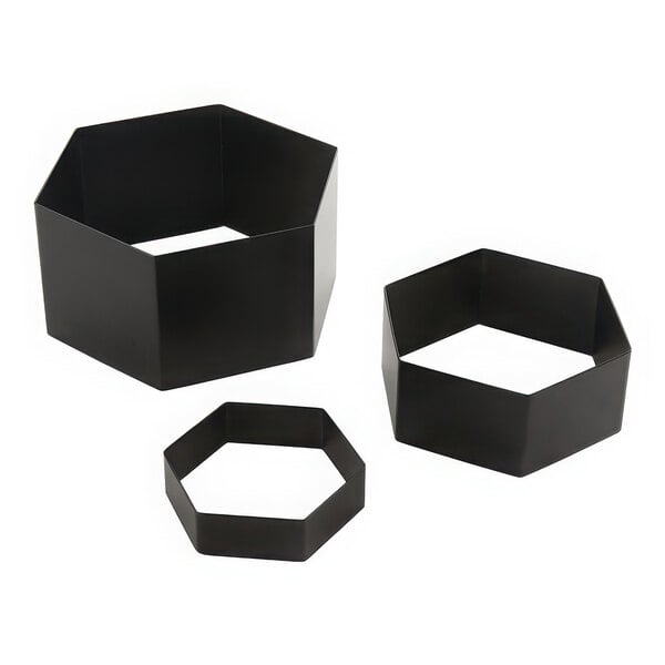 A group of three black metal hexagon risers.