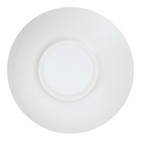 A close-up of a white Cal-Mil melamine soup bowl with a circular pattern on top.