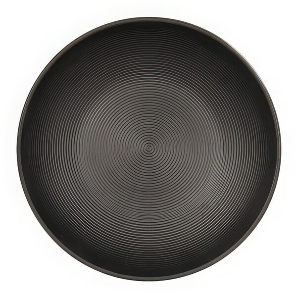 A black bowl with a circular spiral pattern.