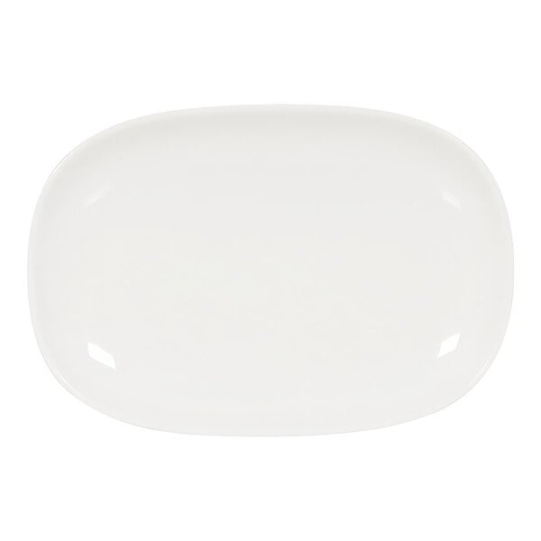 A white Cal-Mil oval melamine plate with a raised rim.