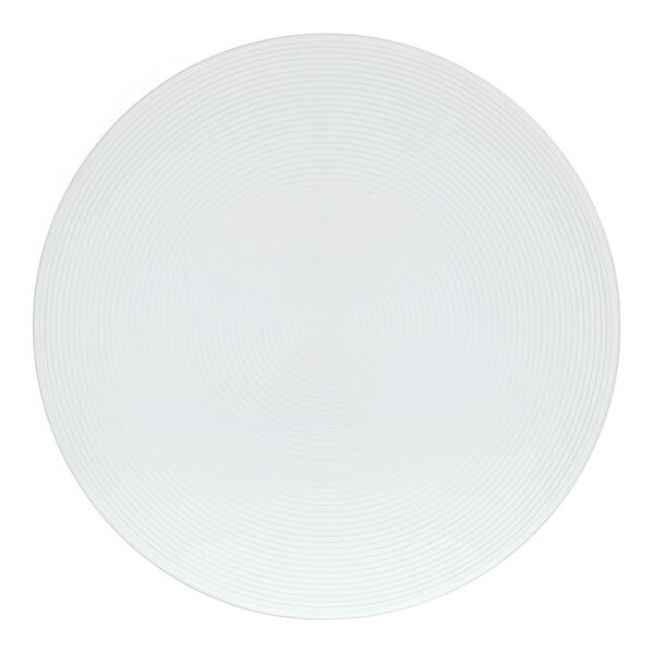 A white Cal-Mil melamine plate with a circular design on it.