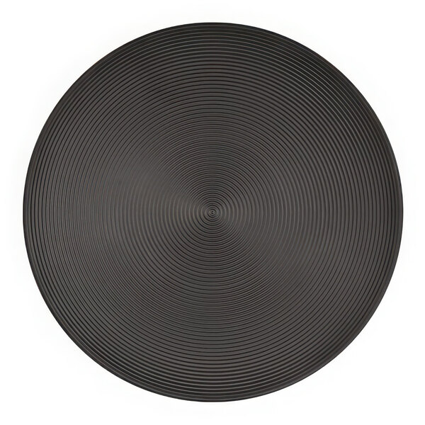 A close-up of a black Cal-Mil melamine plate with a circular pattern.