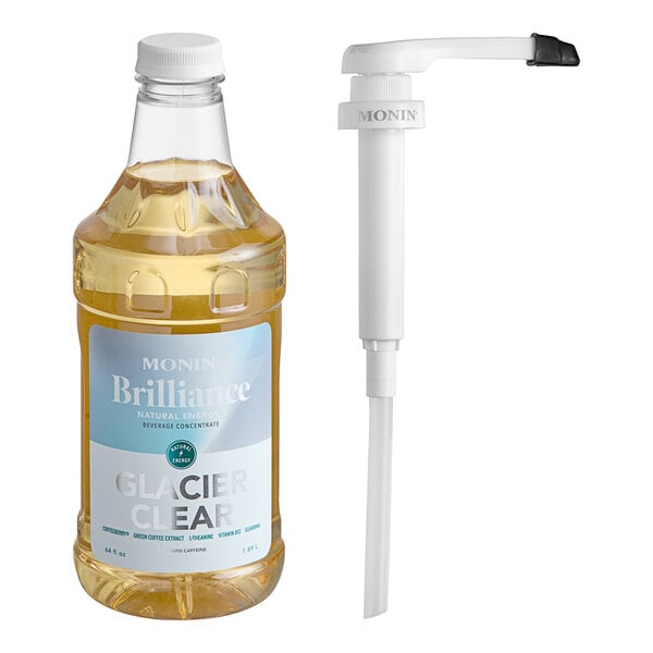 A close up of a Monin Brilliance Glacier Clear Energy Concentrate bottle with a white cap next to a white pump tube.