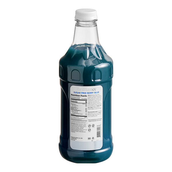 A Monin Brilliance Sugar-Free Berry Blue Energy Concentrate bottle with a blue label and blue liquid.
