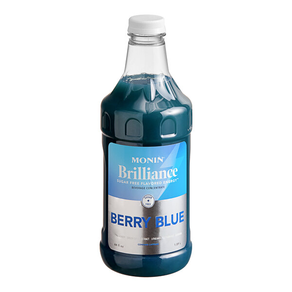 A bottle of Monin Brilliance Sugar-Free Berry Blue Energy Concentrate with a blue label.