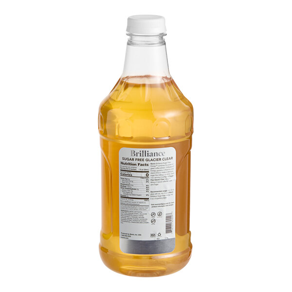 A bottle of Monin Brilliance Sugar-Free Glacier Clear Natural Energy Concentrate with a white label.