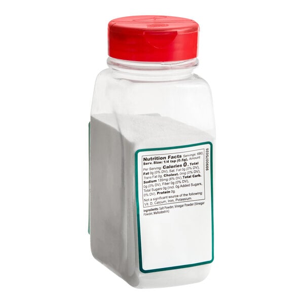A clear plastic container with a red lid, filled with a white powder and featuring a nutrition facts label on the front.