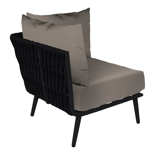 A BFM Seating Cayman black outdoor corner chair with a Sunbrella charcoal cushion.