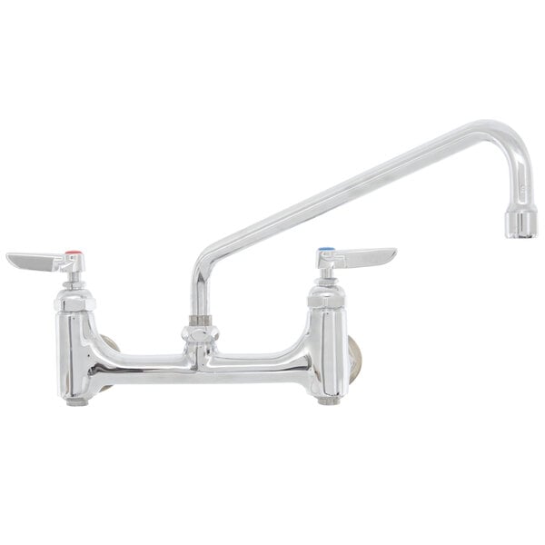 A close-up of a chrome T&S wall mount pantry faucet with two handles and a hose.