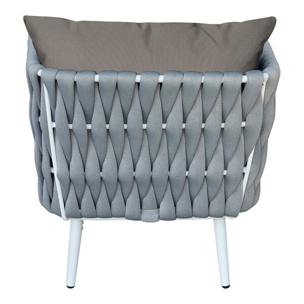 A white outdoor armchair with grey rope and a charcoal cushion and back pillow.