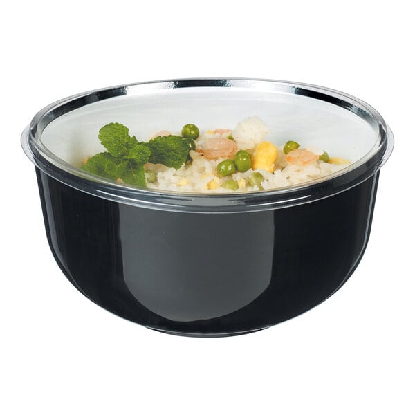 A black Solia plastic bowl with rice and vegetables inside.