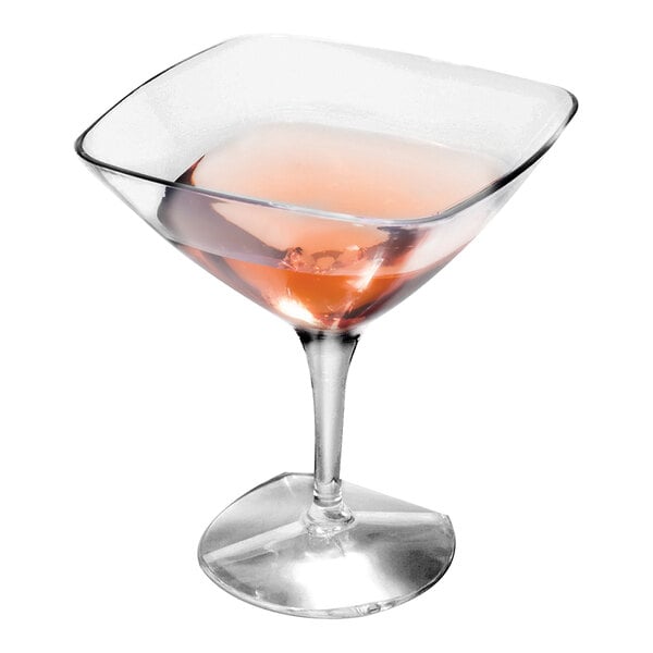 A Solia clear plastic mini martini cup filled with a pink drink.