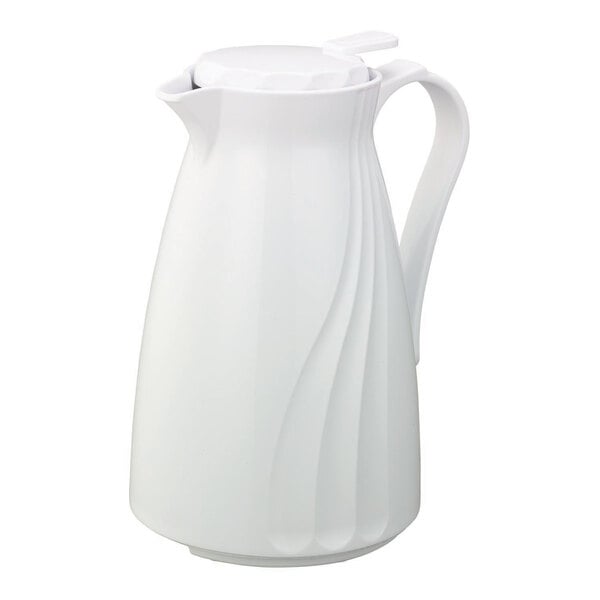 A white pitcher with a handle and push-button lid.