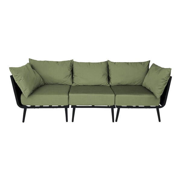 A black BFM Seating Cayman outdoor couch with black legs and green Sunbrella cushions.