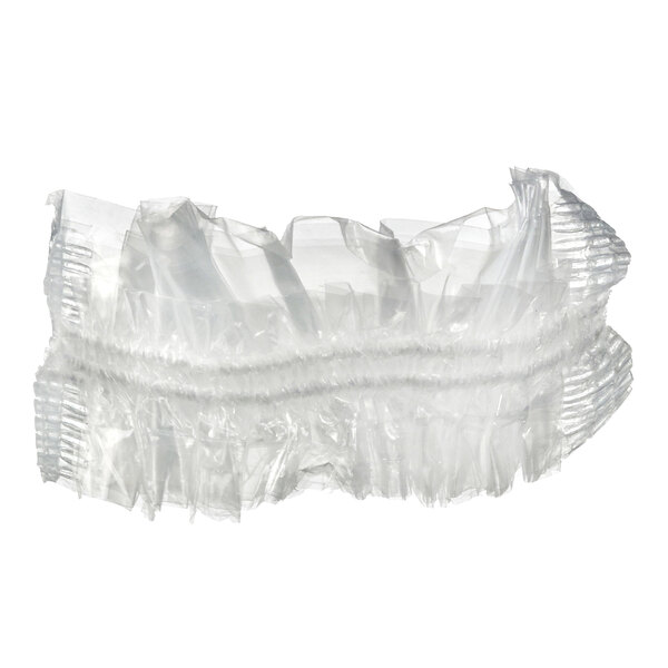 A stack of clear disposable shower caps for mini dishes.