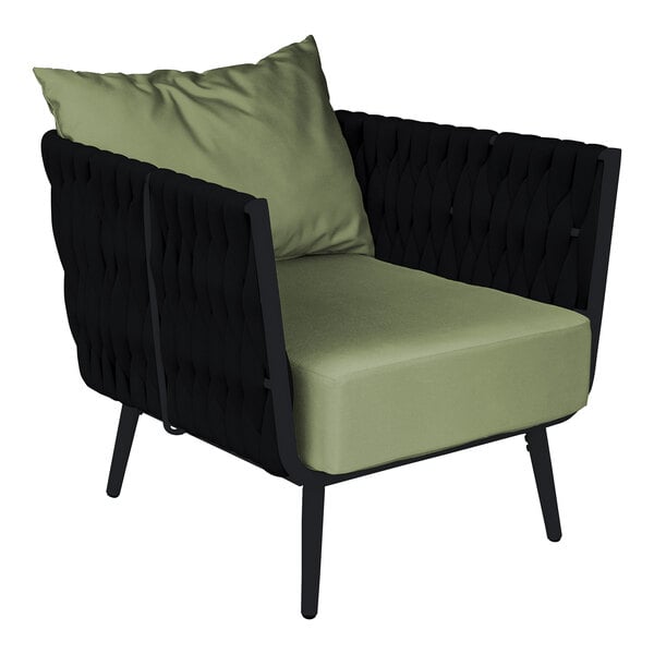 A BFM Seating black outdoor armchair with green Sunbrella cushions and back pillow.