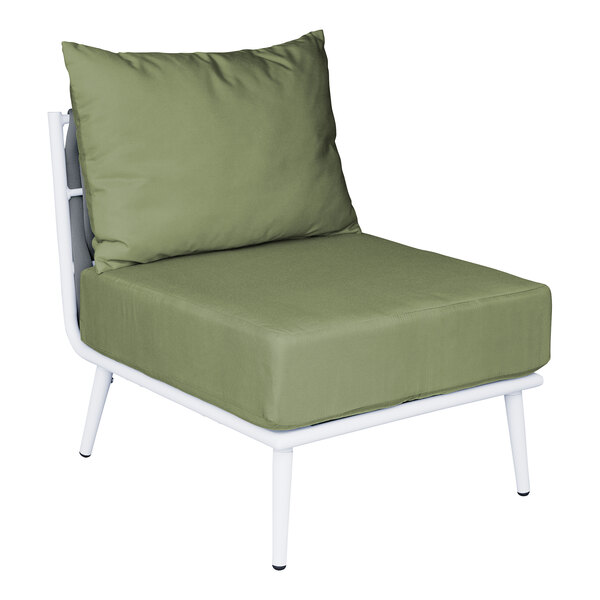 A white BFM Seating Cayman outdoor couch middle section with a Sunbrella fern cushion and back pillow on a green chair with white legs.