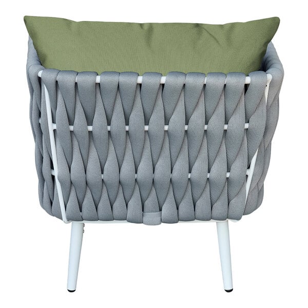 A white wicker outdoor armchair with gray rope and a green cushion and pillow.