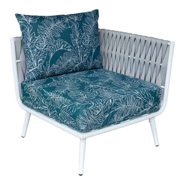 A close-up of a BFM Seating white outdoor couch corner section with blue Sunbrella cushion and back pillow.