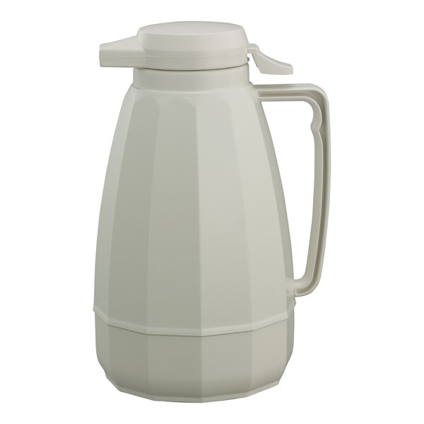 A white plastic coffee carafe with a lid and handle.
