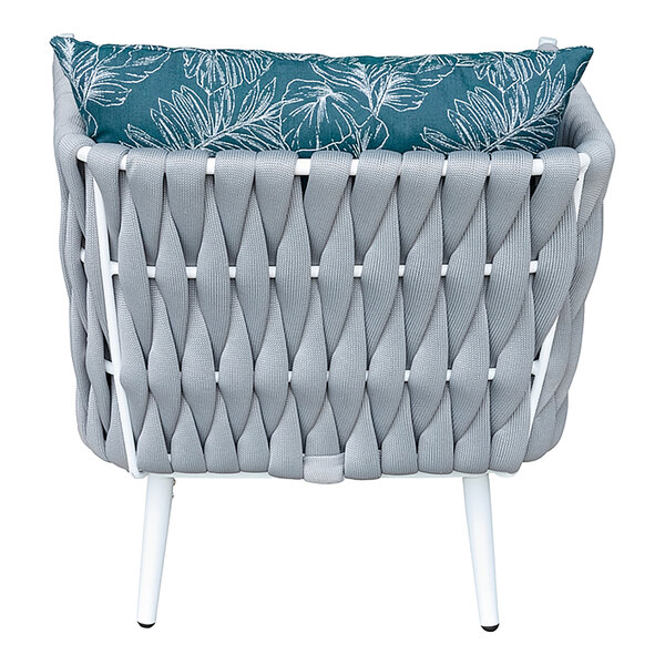 A white BFM Seating wicker armchair with a blue cushion and pillow.