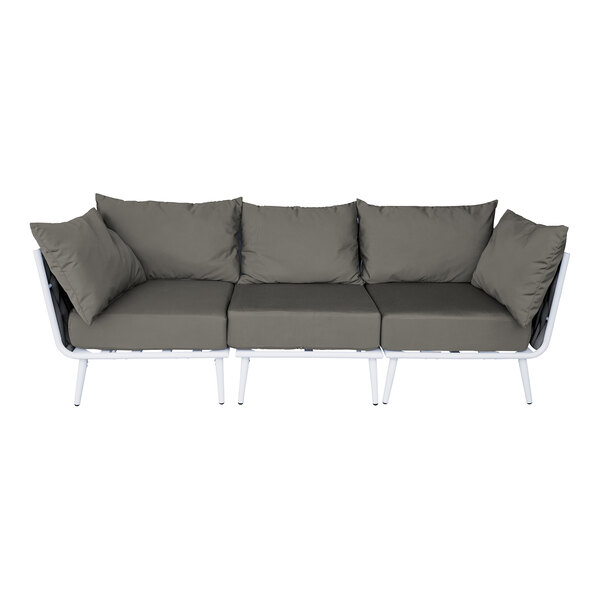 A white outdoor couch with grey rope and Sunbrella charcoal cushions and 5 back pillows.