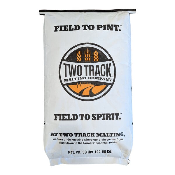 A large white bag labeled 'Two Track Malting Company' with black and orange graphics and text, weighing 50 lbs (22.68 kg).