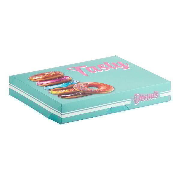 A Southern Champion "Tasty" donut box with pink and blue icing on the donuts.