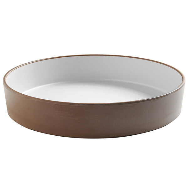 A brown and white Cal-Mil stoneware plate with a raised white rim.