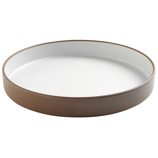 A white and brown Cal-Mil stoneware plate with a raised rim.