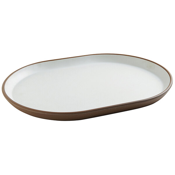 A white oval plate with raised brown rims.