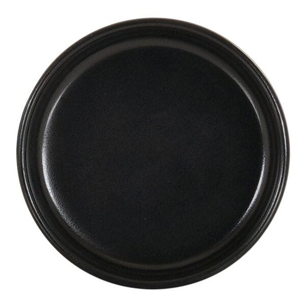 A small, round, black melamine ramekin with straight sides.