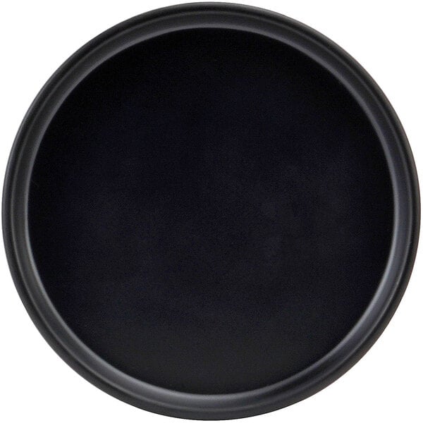 A black round Cal-Mil melamine plate with a low rim.