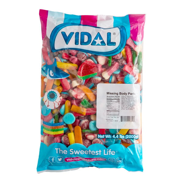 A large, colorful bag of assorted gummy candies shaped like various body parts, labeled 'VIDAL Missing Body Parts' with a net weight of 4.4 lbs (2000g).