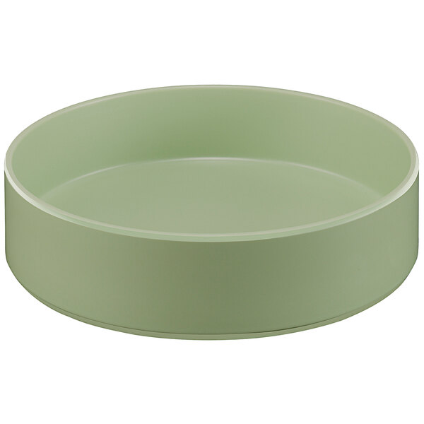 A close up of a green Cal-Mil Melamine bowl with a raised rim.