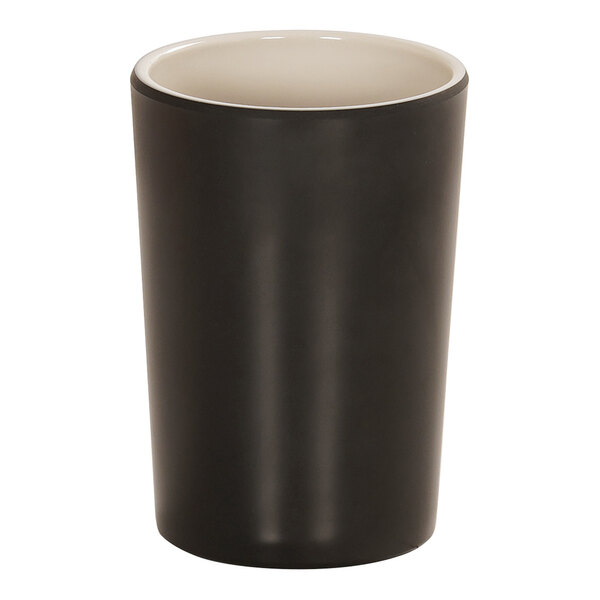 A two-tone ivory and black plastic cup with a black rim.