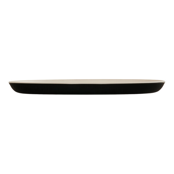 A Cal-Mil Sophie ivory melamine plate with a black rim.