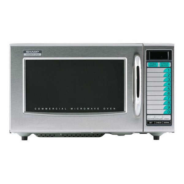 A silver Sharp commercial microwave with a black rectangular touch screen display.