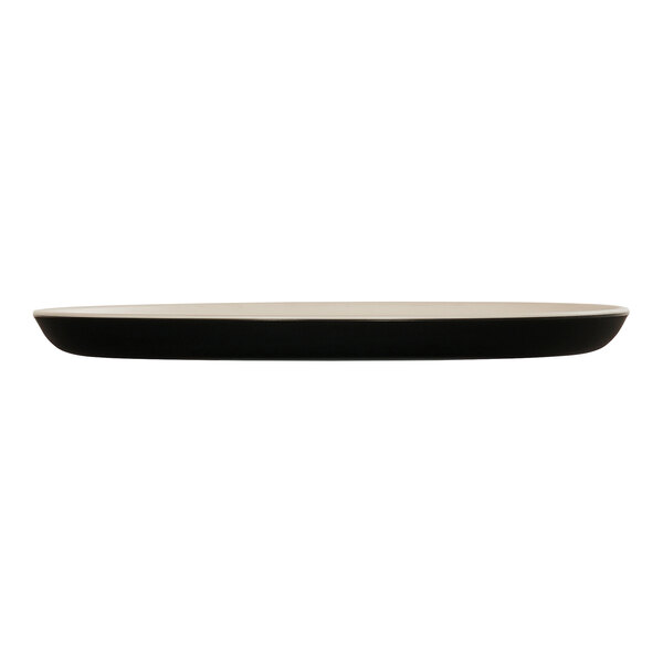 A Cal-Mil Sophie ivory and black melamine plate with a white rim.