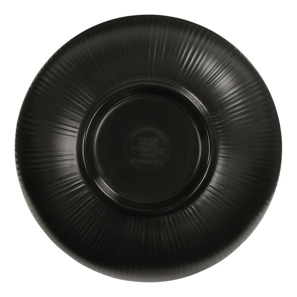 A black bowl with a circular pattern on the bottom.