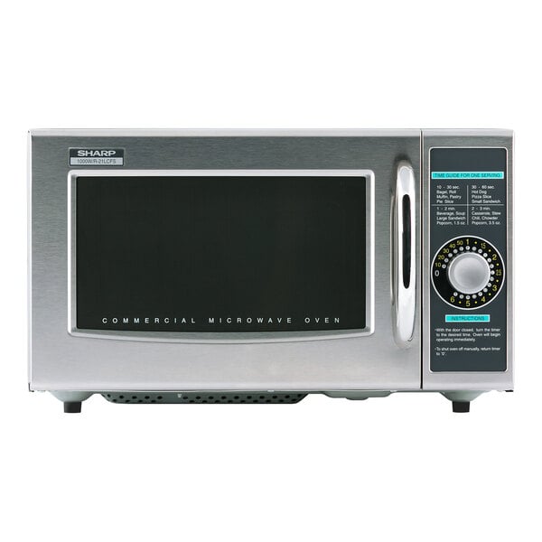 A silver Sharp medium-duty commercial microwave with a dial control.